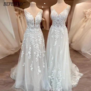 Изящные свадебные платья с винтажной вышивкой в виде цветка без рукавов, стильные свадебные платья в стиле бохо, свадебное платье трапециевидного силуэта для невест